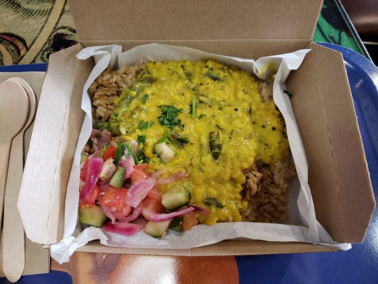 Golden red lentil dahl served with rice and salad