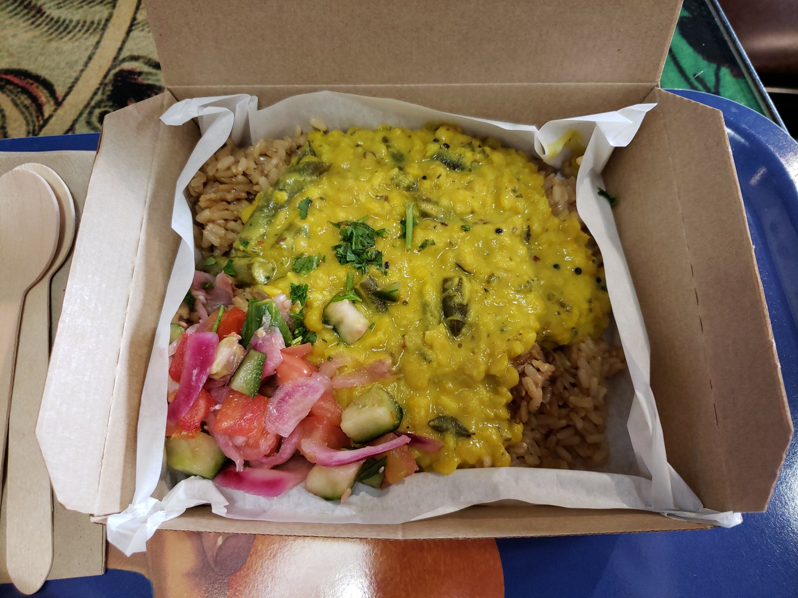 Home 17 Golden red lentil dahl served with rice and salad