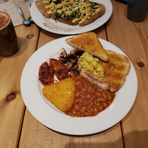 Vegan breakfast plate with tofu scramble, beans, mushrooms and toast